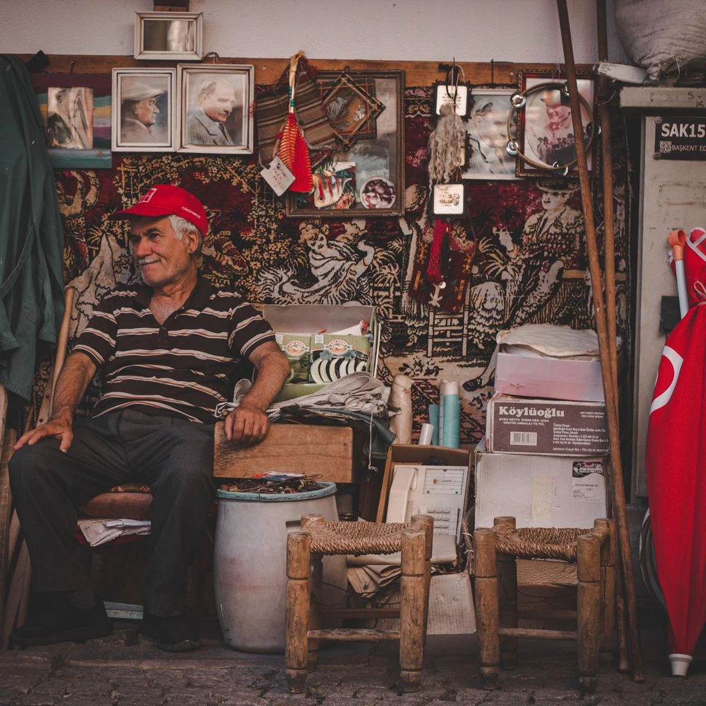 Portrait of a Portuguese decorative antiques dealer in her Lisbon shop.