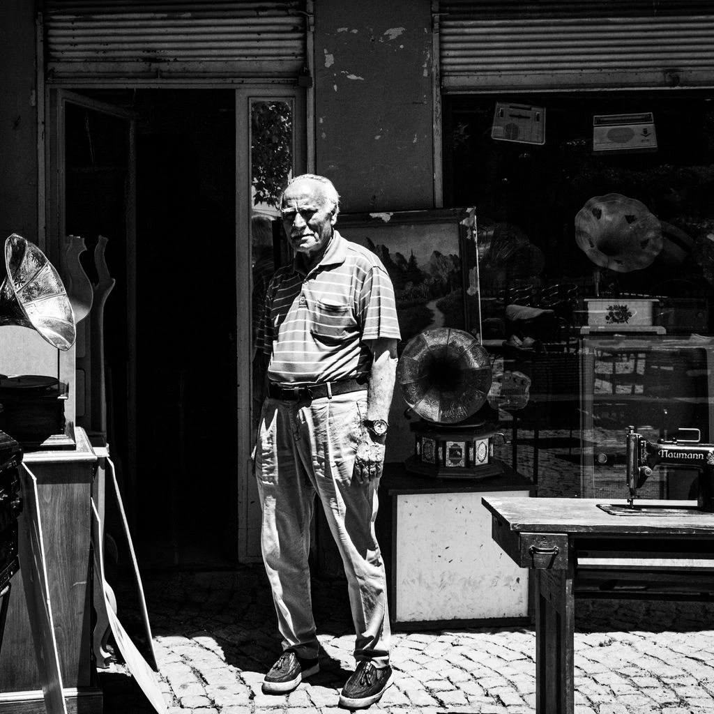 Portrait of a British mineral dealer in his London gallery.